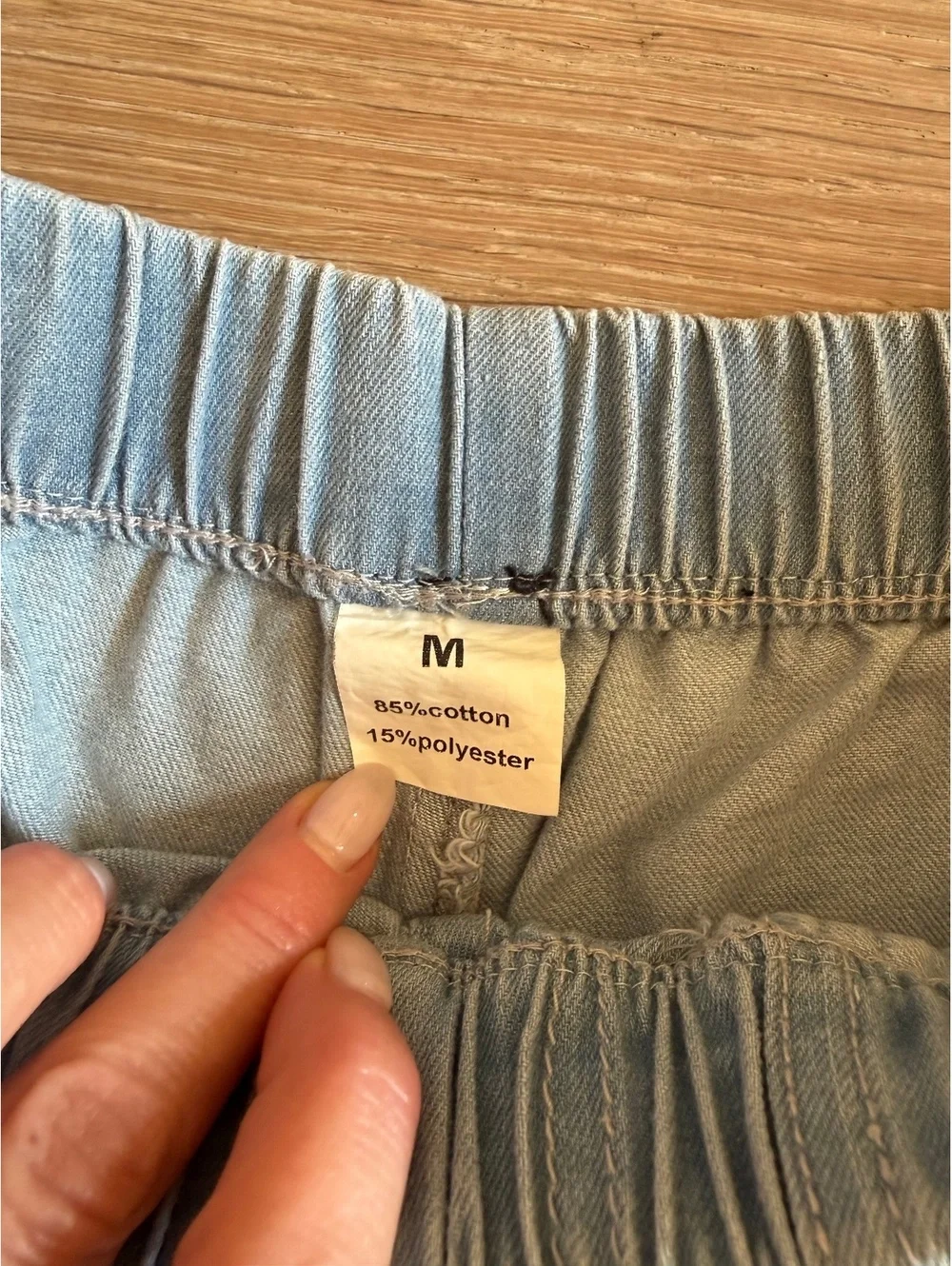Pull on drawstring, casual light wash denim shorts for women raw hem size Medium